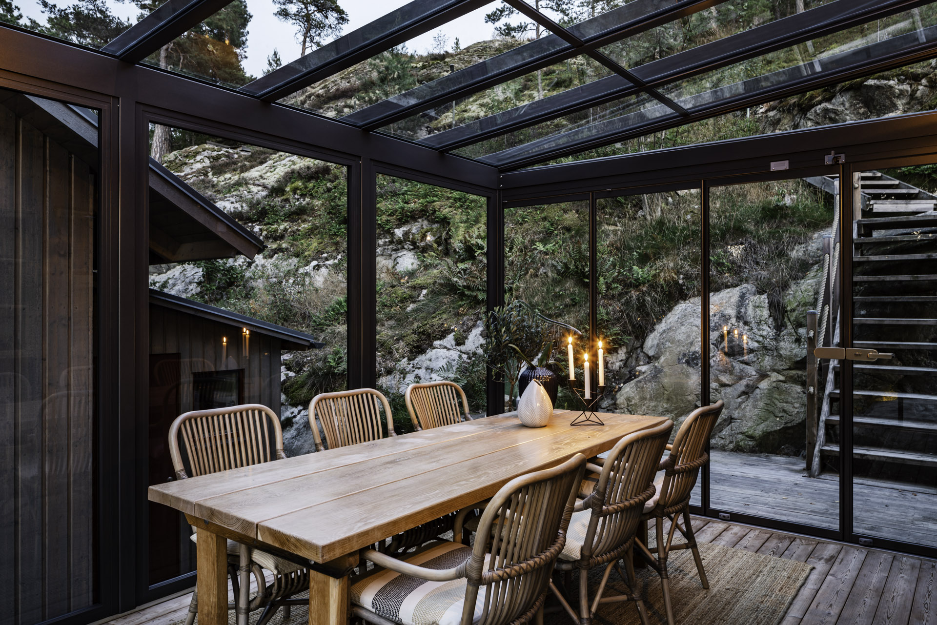 table and chairs in a glass room