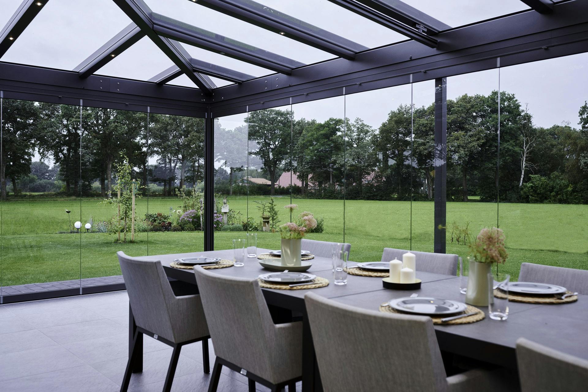 beautiful atrium plus glass room with table and chairs