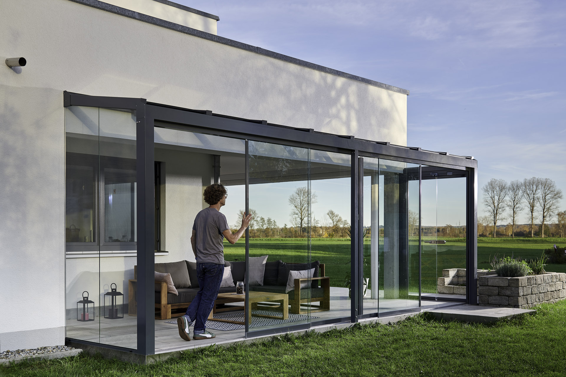 Person opening a glass sliding door