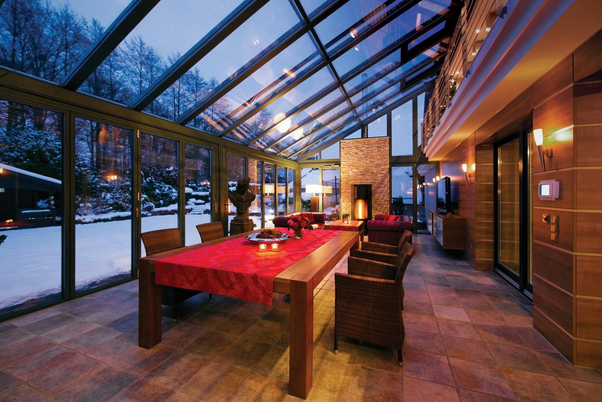 Red Christmas dining table in snowy kitchen extension