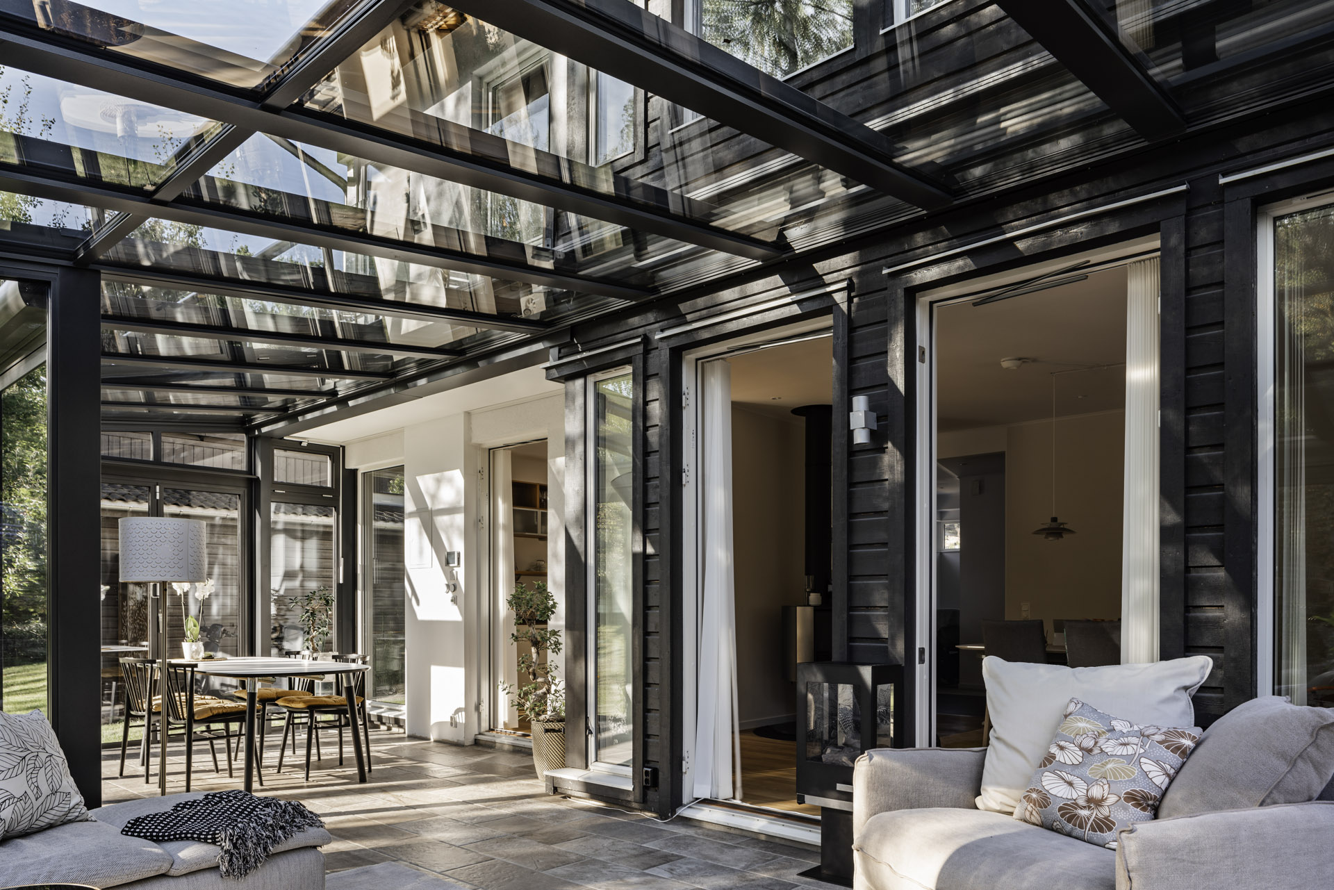 A glass extension with natural light streaming into the living space