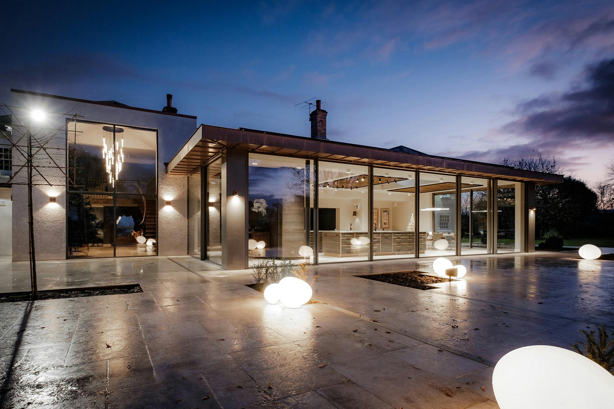 Oversized sliding glass doors in Yorkshire at night time
