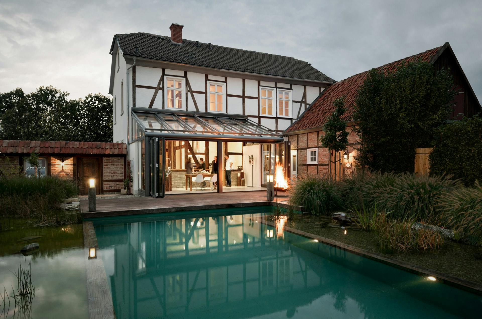 A luxury detached house with glass extension in dusky light
