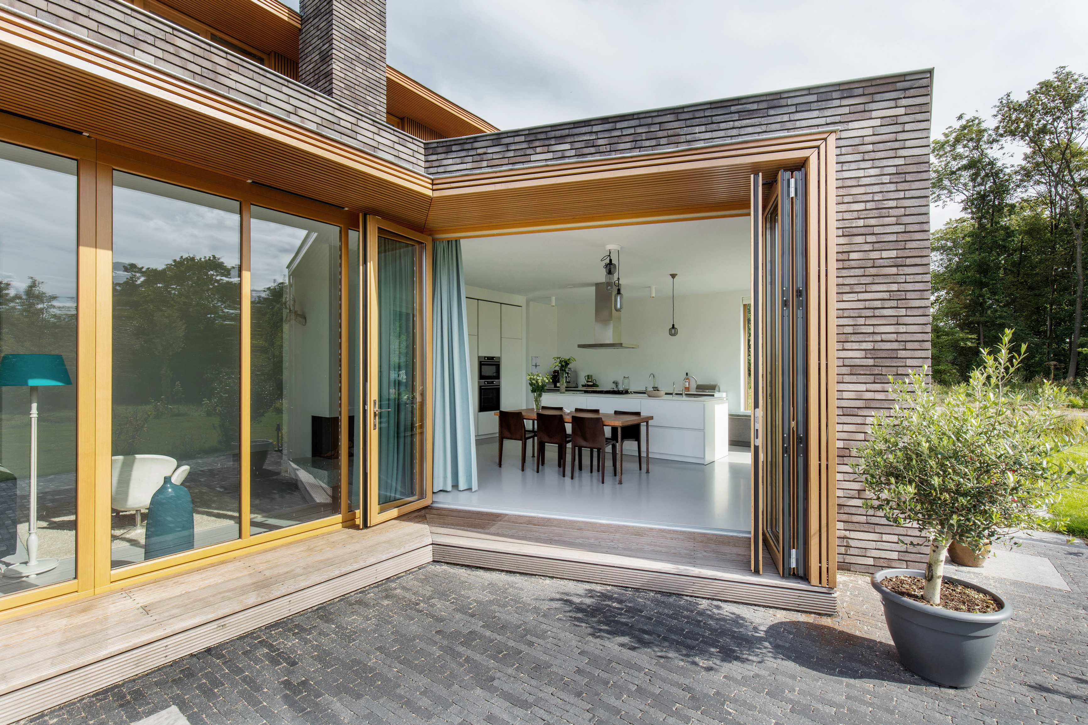 Luxury timber bi-fold doors from an external perspective