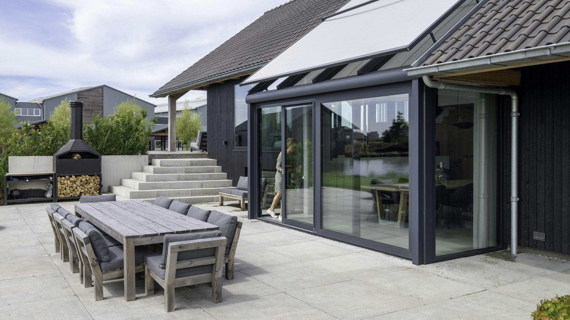 orangery extension on modern property and patio creates indoor outdoor living space