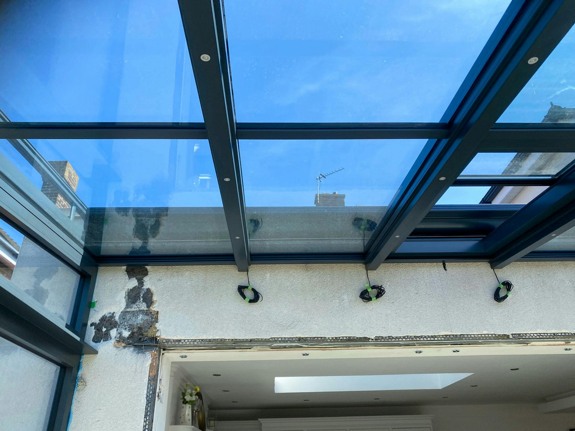 wall fixings help stability of glass extensions