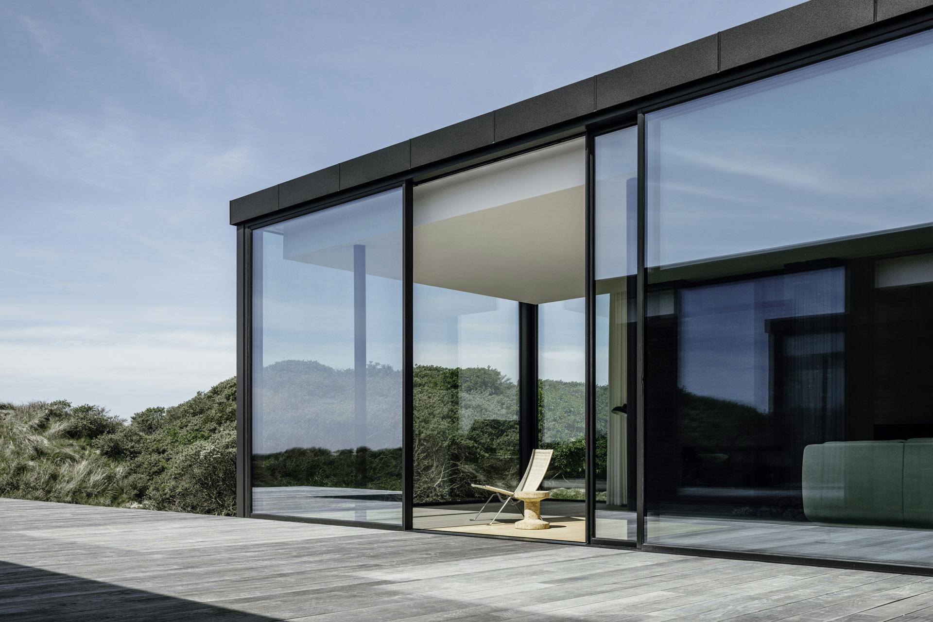 sliding patio doors at beachfront property with deckchair