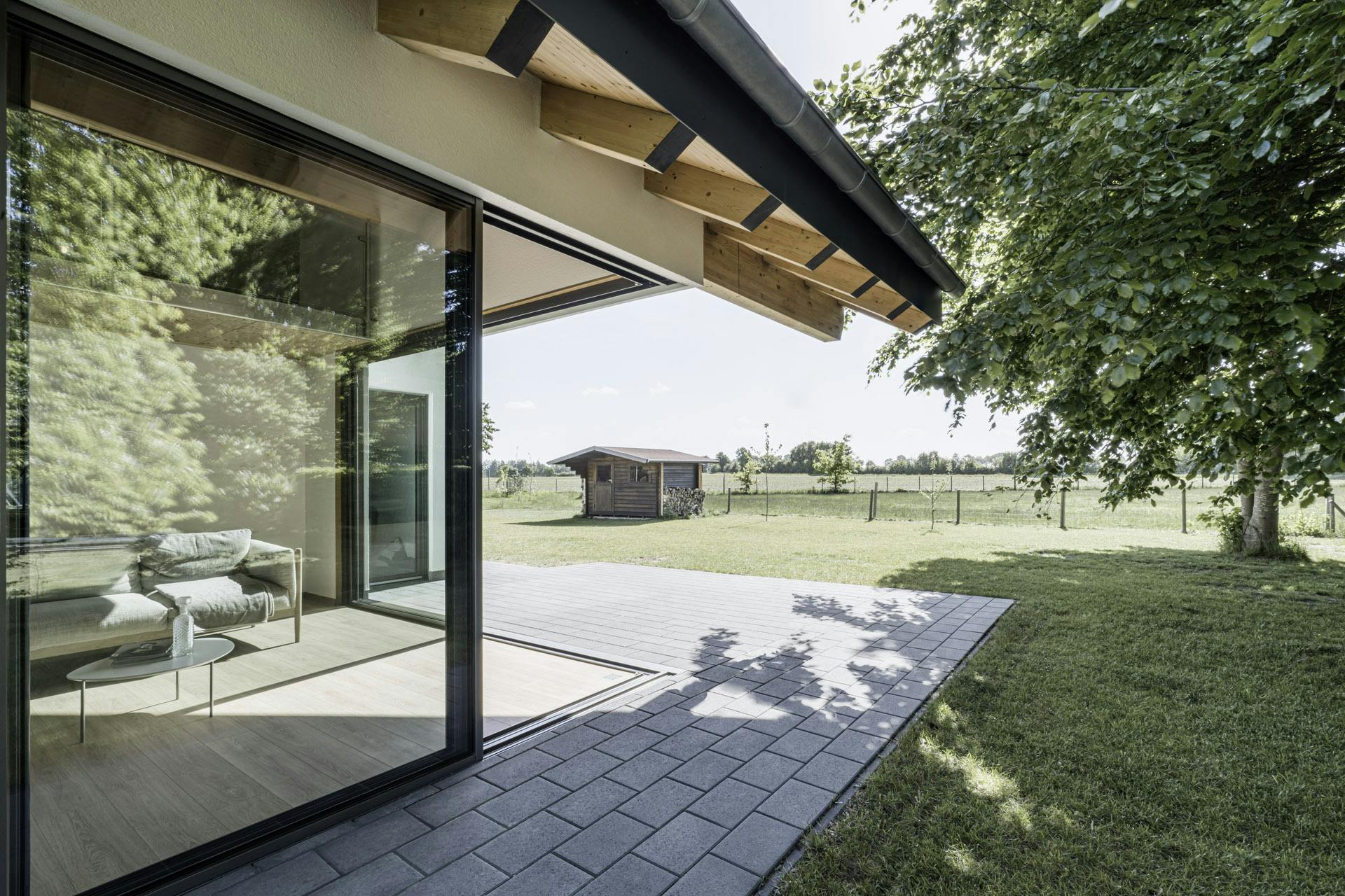 exterior of corner glass doors with cantilever roof