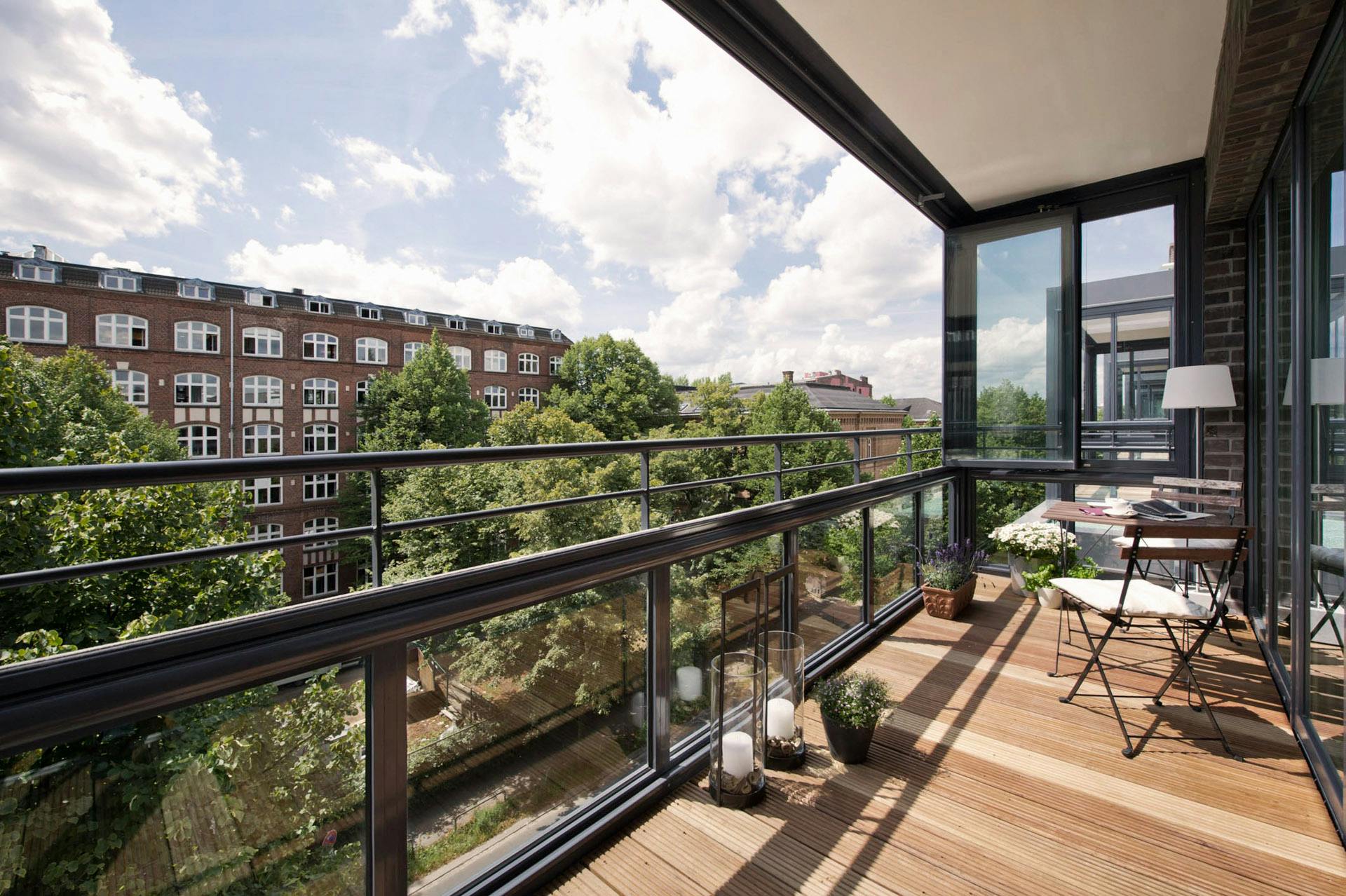 balcony overlooking cityscape on cloudy sunny day
