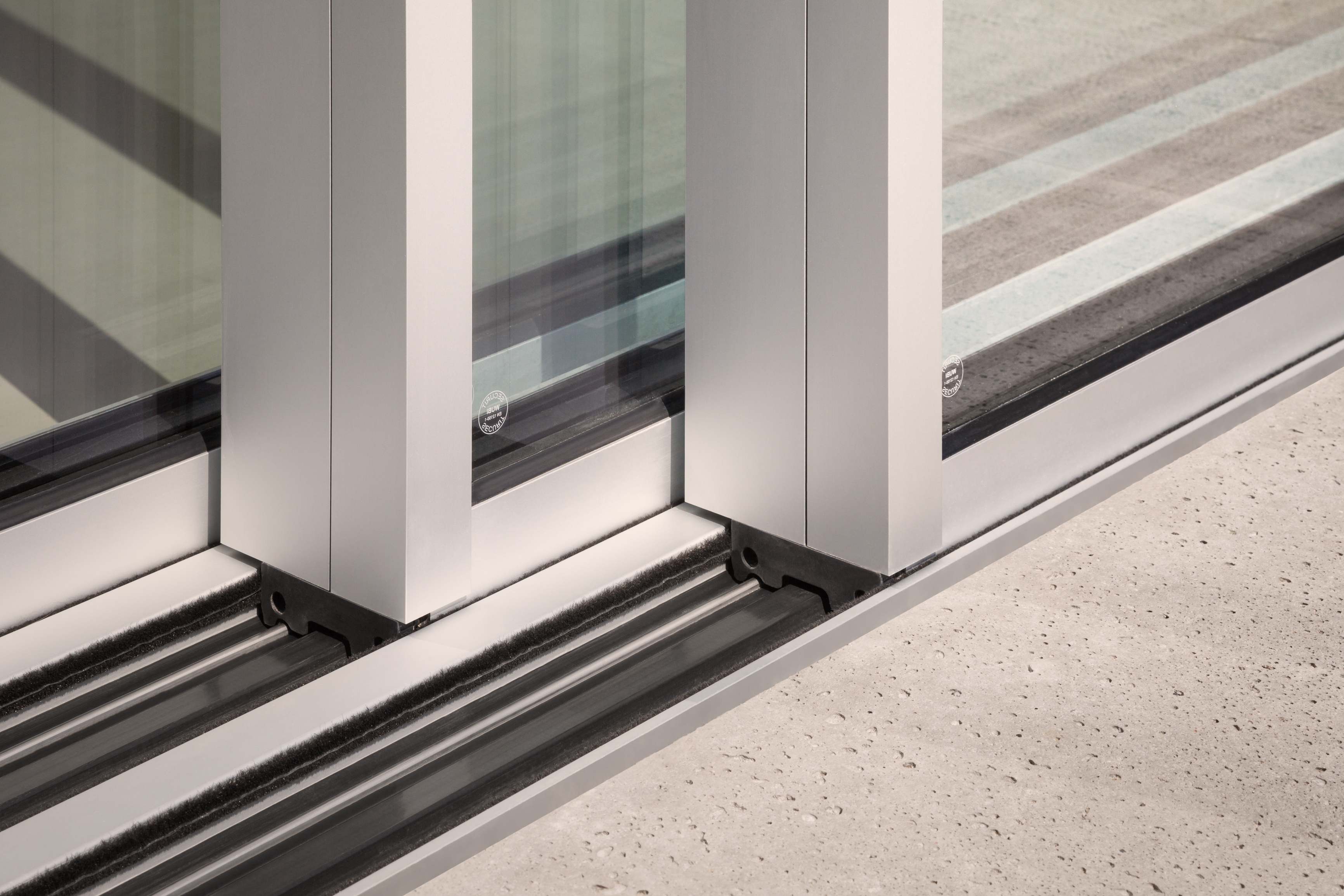 Close up of zero threshold sliding door tracks