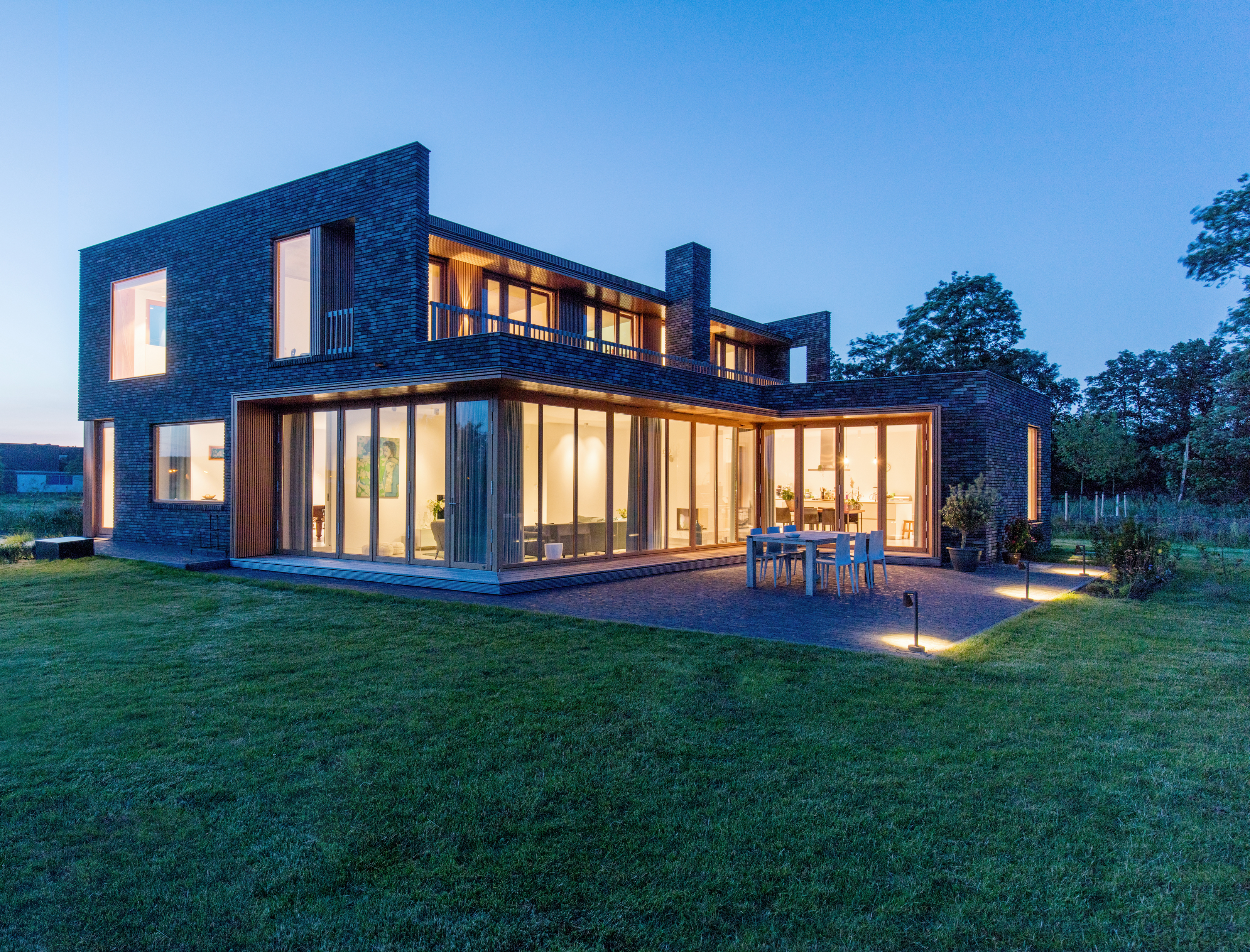 A twilight shot of closed bi-folds with soft lighting