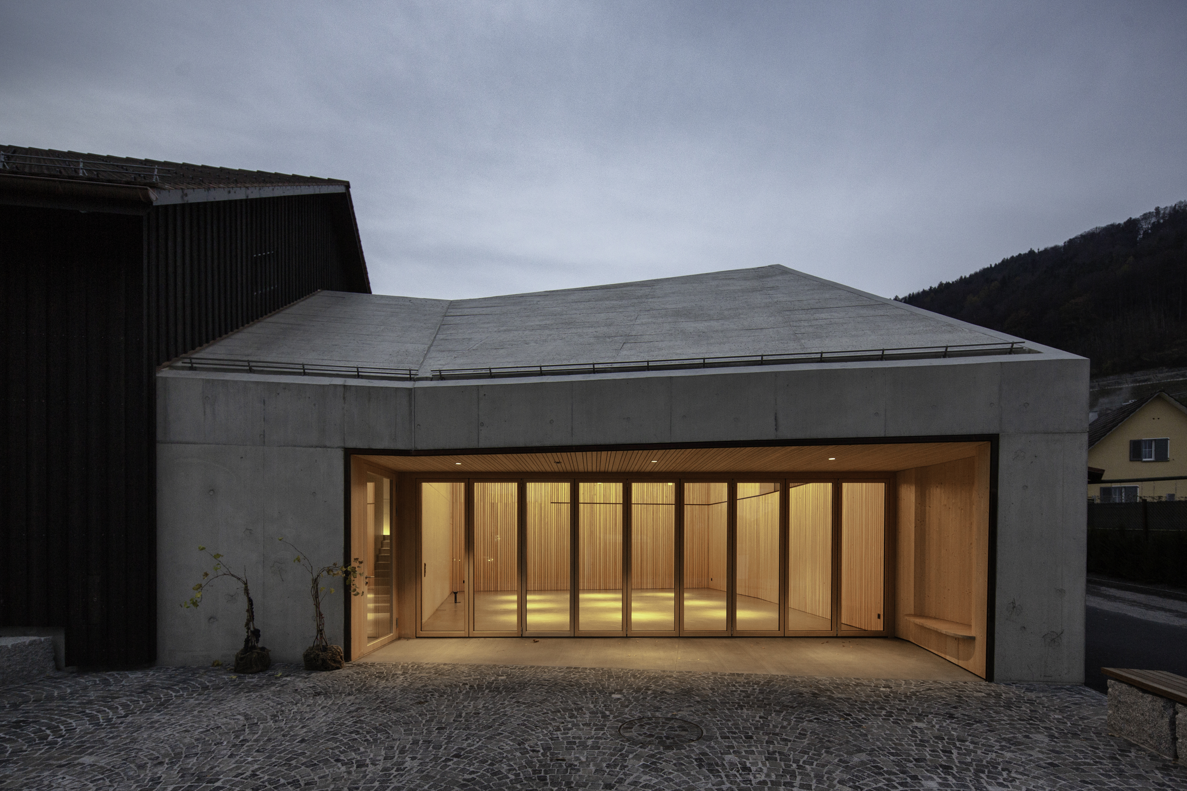 A large closed bi-fold door at night with soft lighting