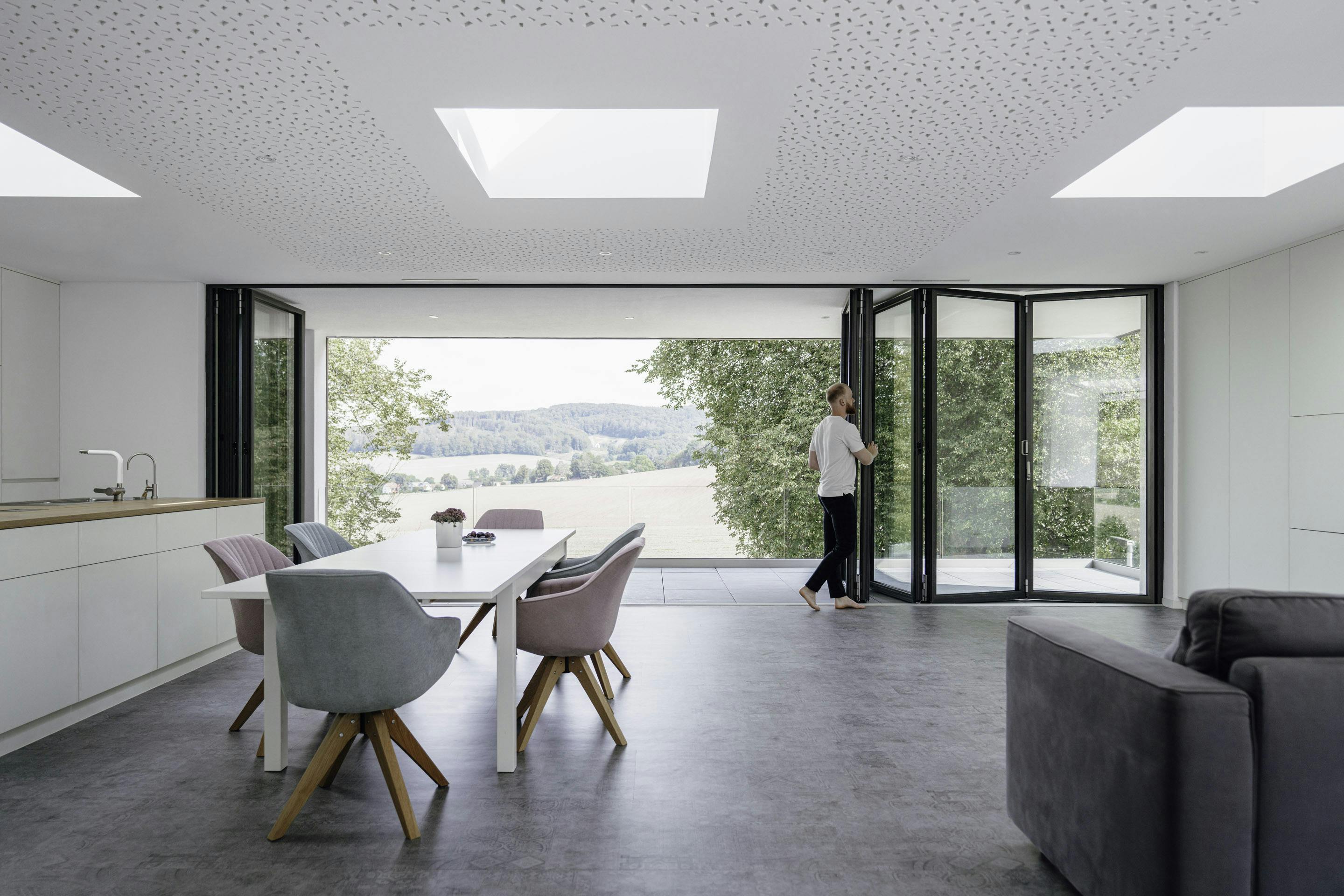 Bi-fold doors at the back of a home lounge area