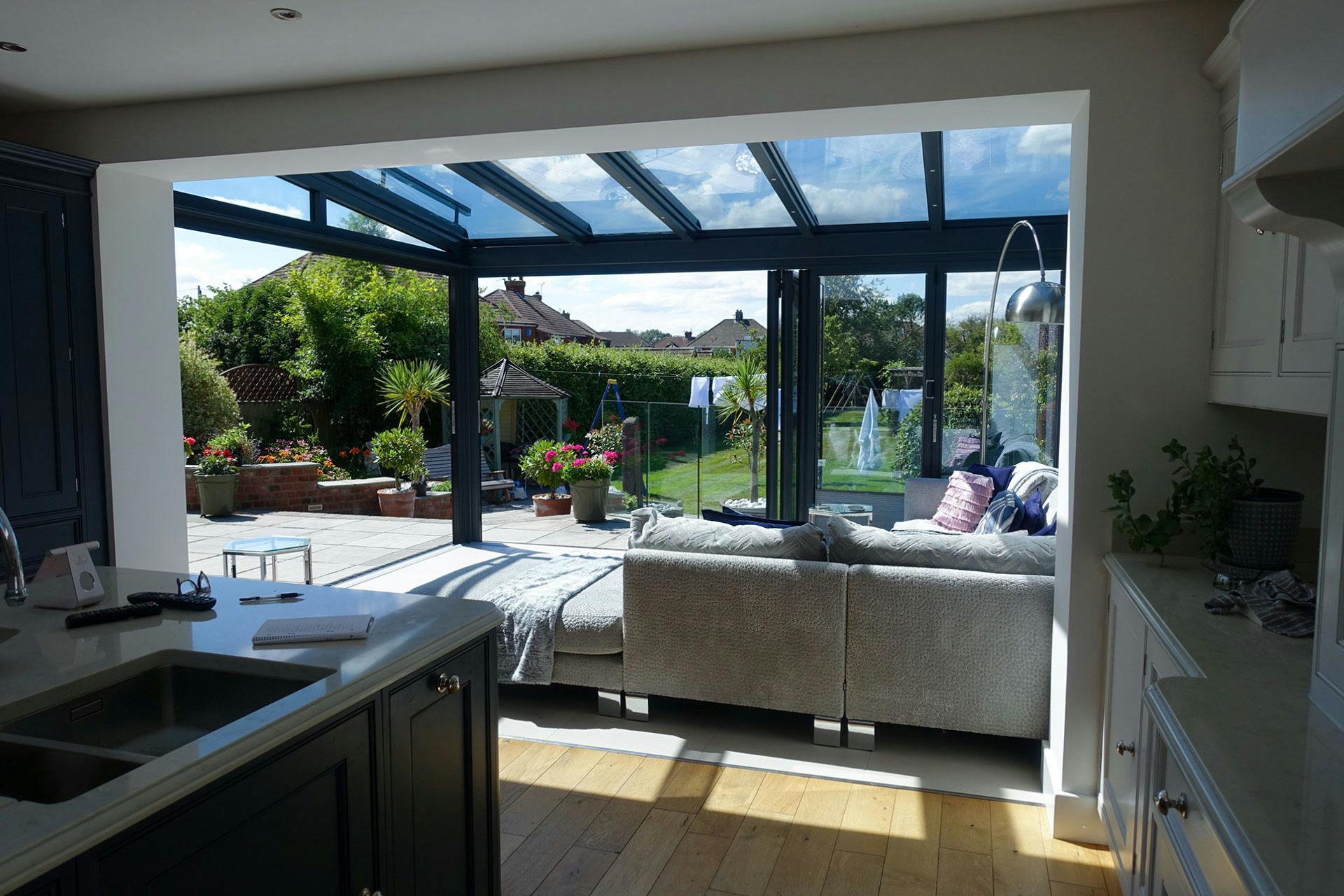 garden view from kitchen through glass room extension