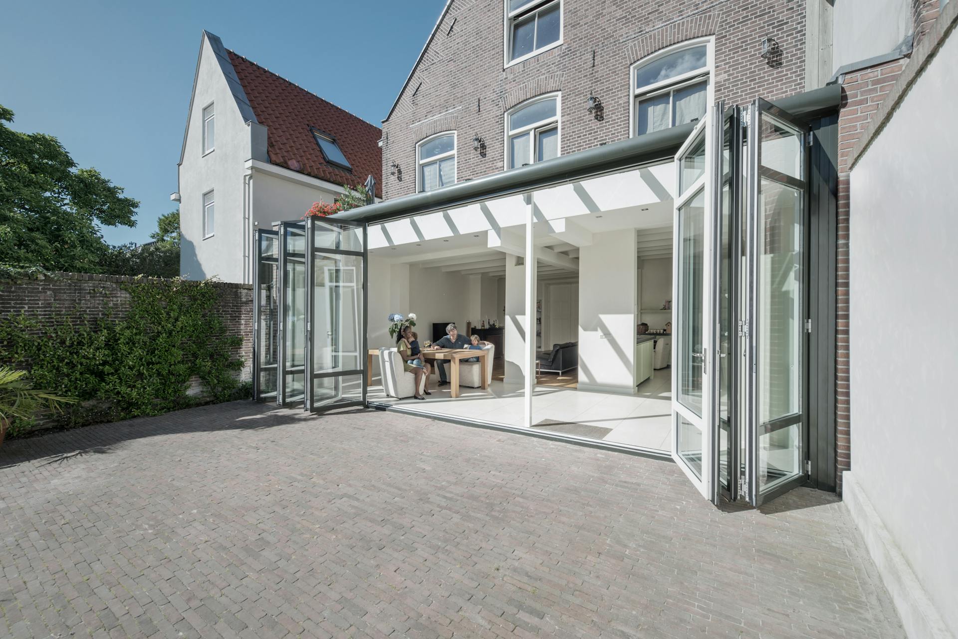 Large home extension with wide set of bifold doors open fully