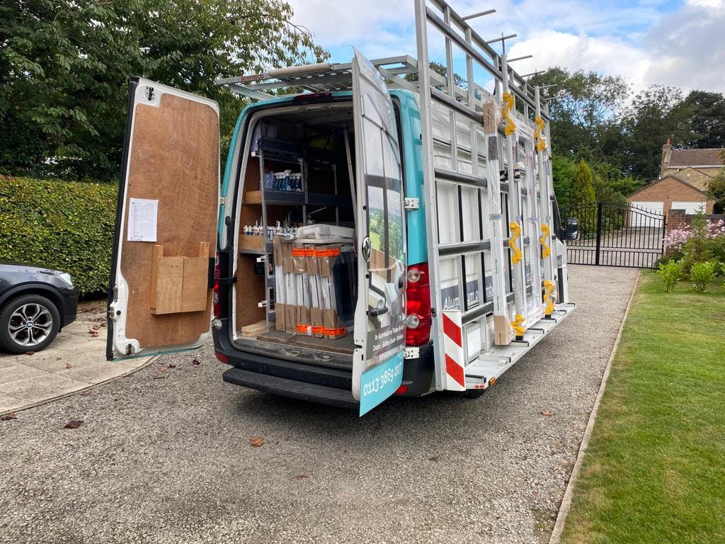 Reveal van at a glass extension project