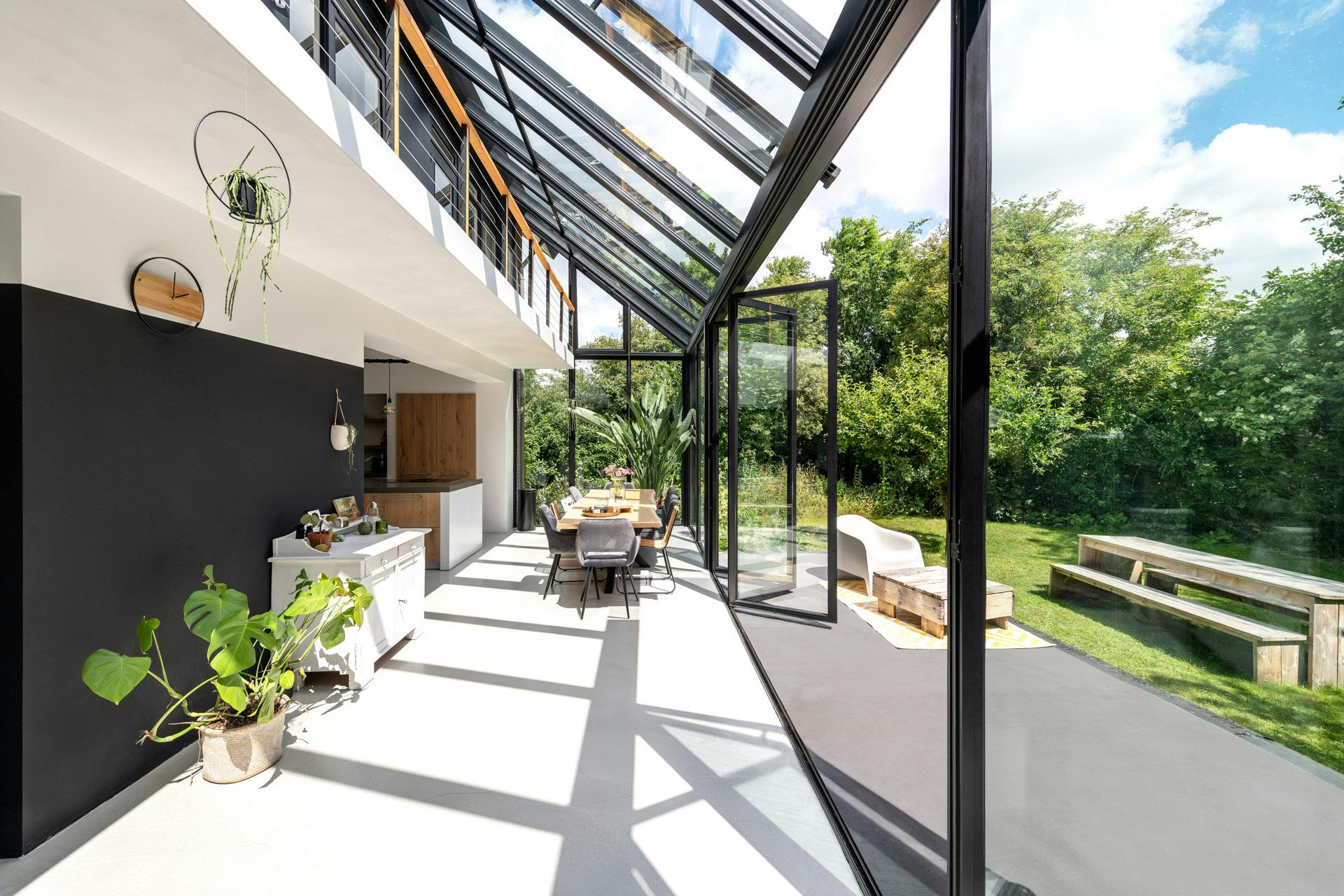 double height glass extension with large sliding doors