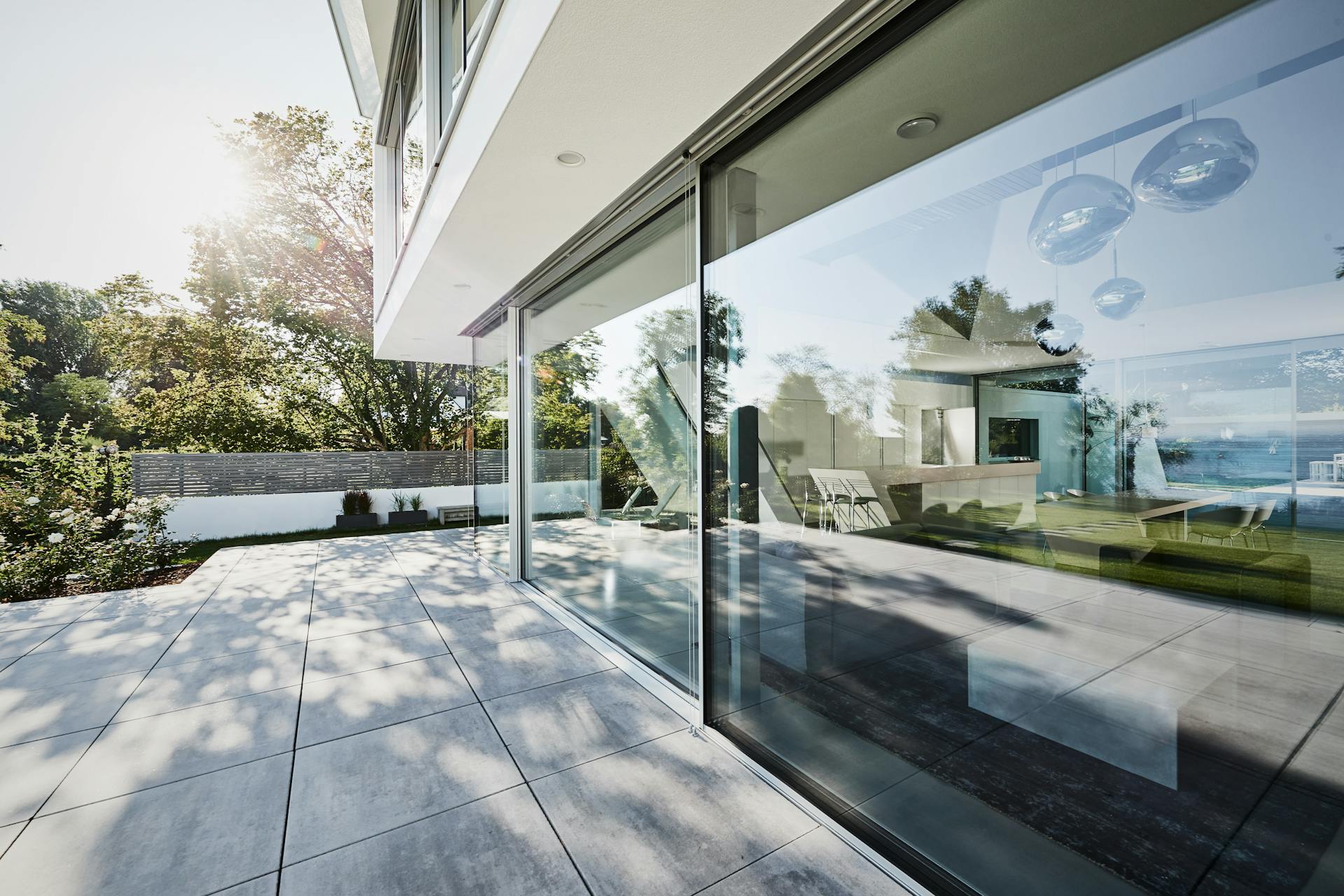 Glazed sliding doors in contemporary home with patio