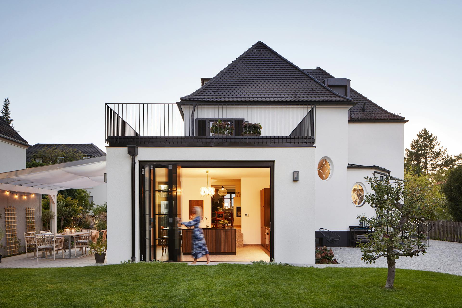 detached white house with bifolding doors