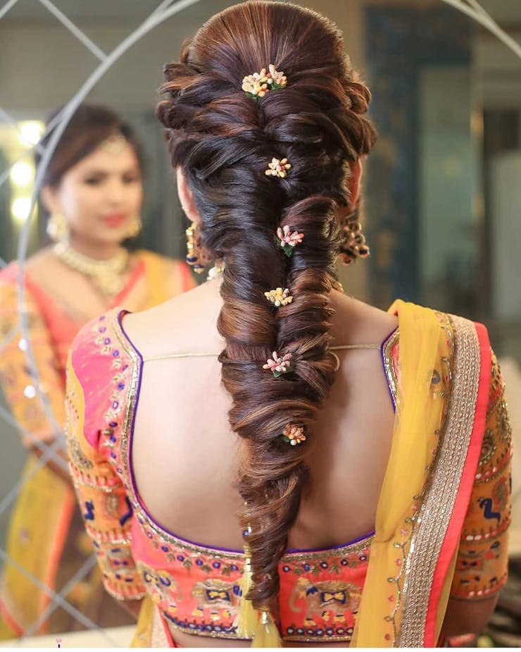 eye-catchy haldi ceremony hairstyle for brides