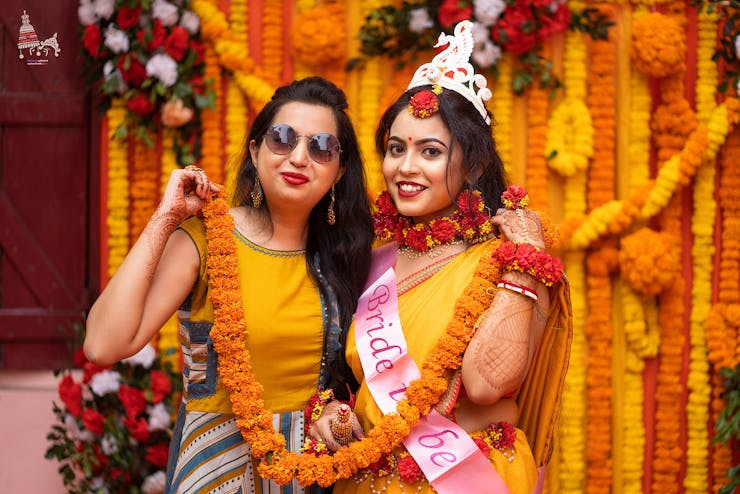 bridesmaids poses with props