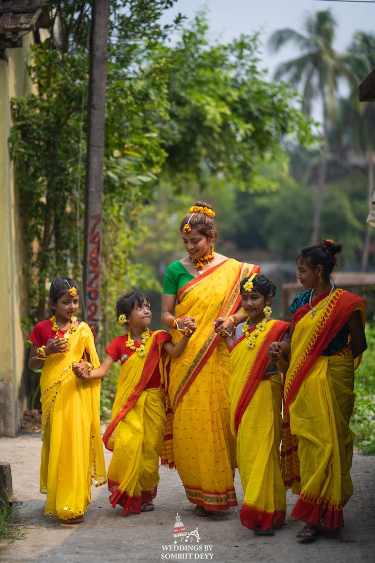 haldi poses with little kids