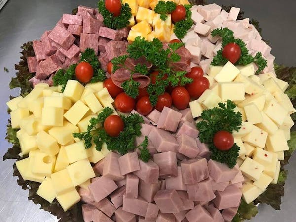 Deli tray of cubed meats and cheeses