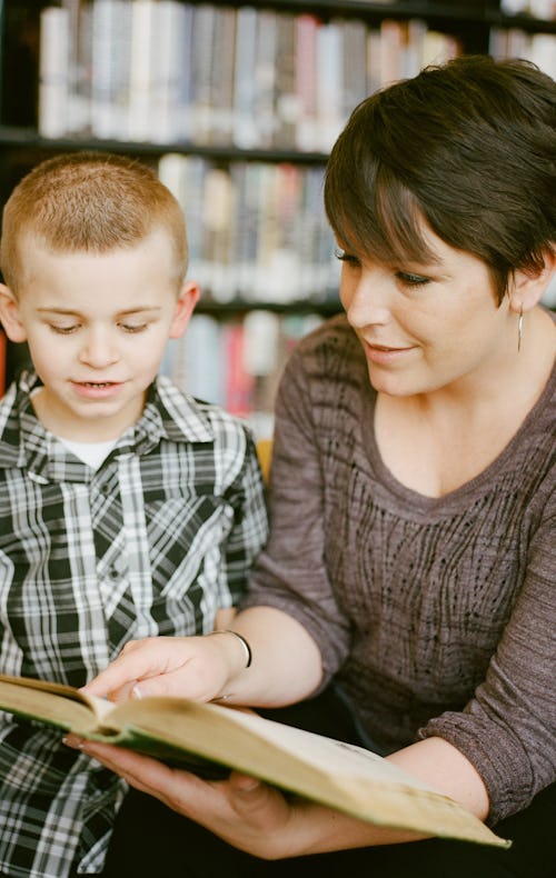 women is reading to a child 