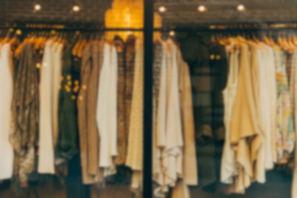 a rack of clothes from a fashion company on the stock market