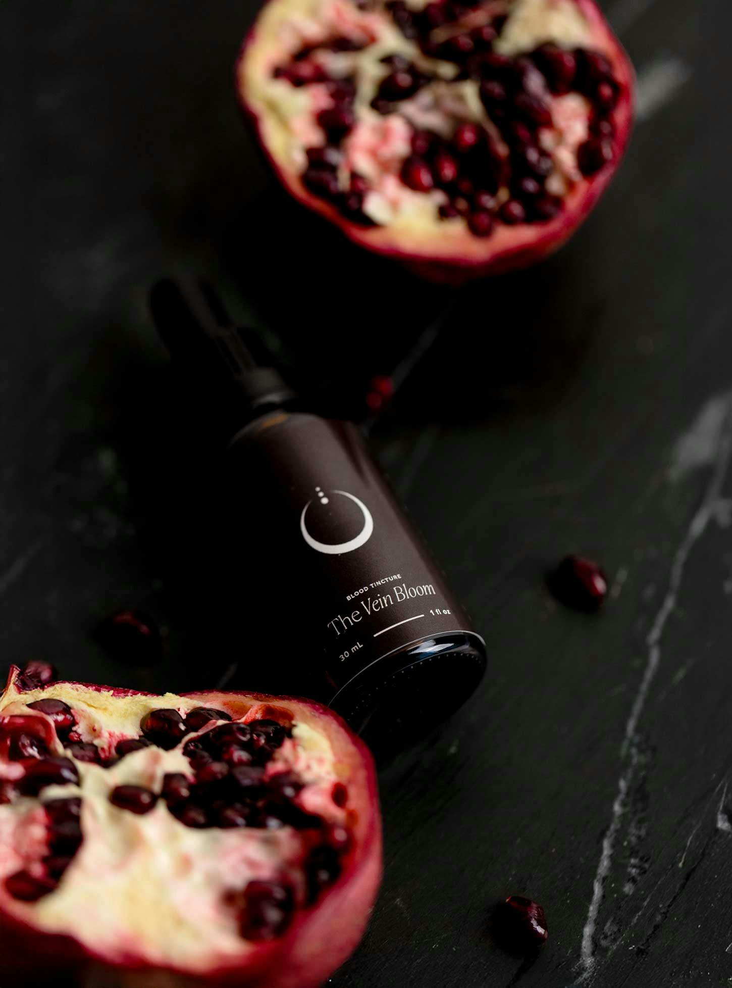 Tincture bottle set against dark background