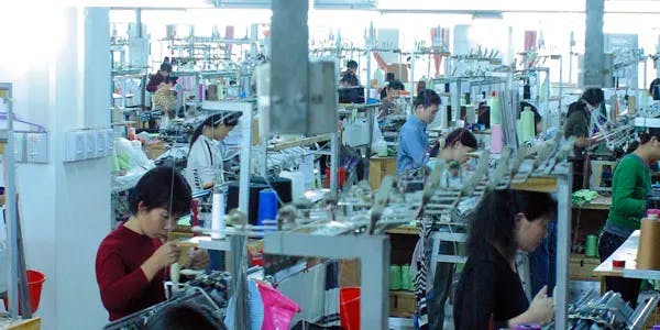 Image of workers in a clothing factory