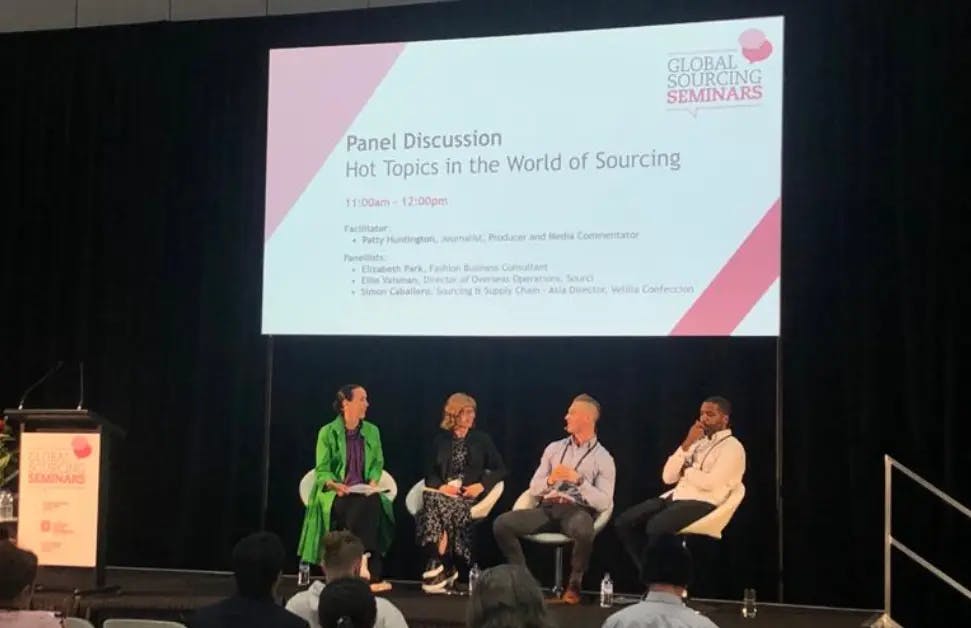 Image of speakers at a global sourcing seminar