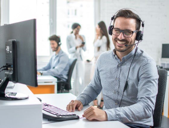 Smiling customer service representative on a call
