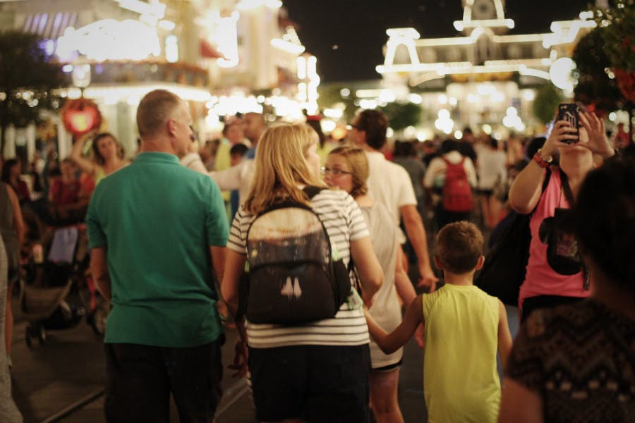 Family walking through a crowd