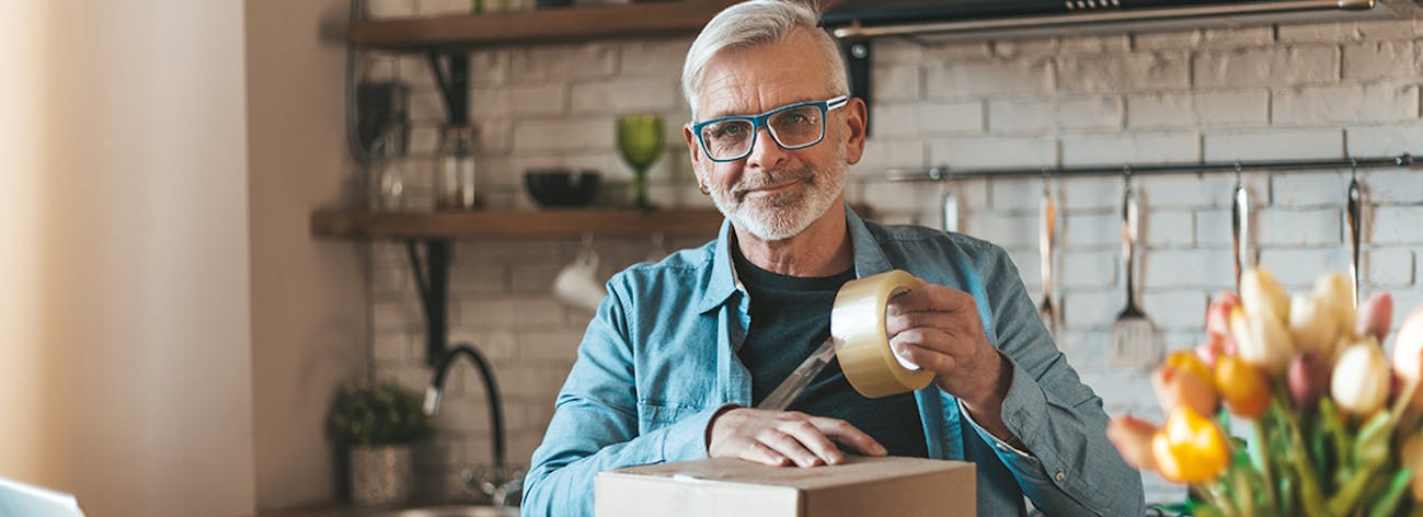 Small business owner packing goods