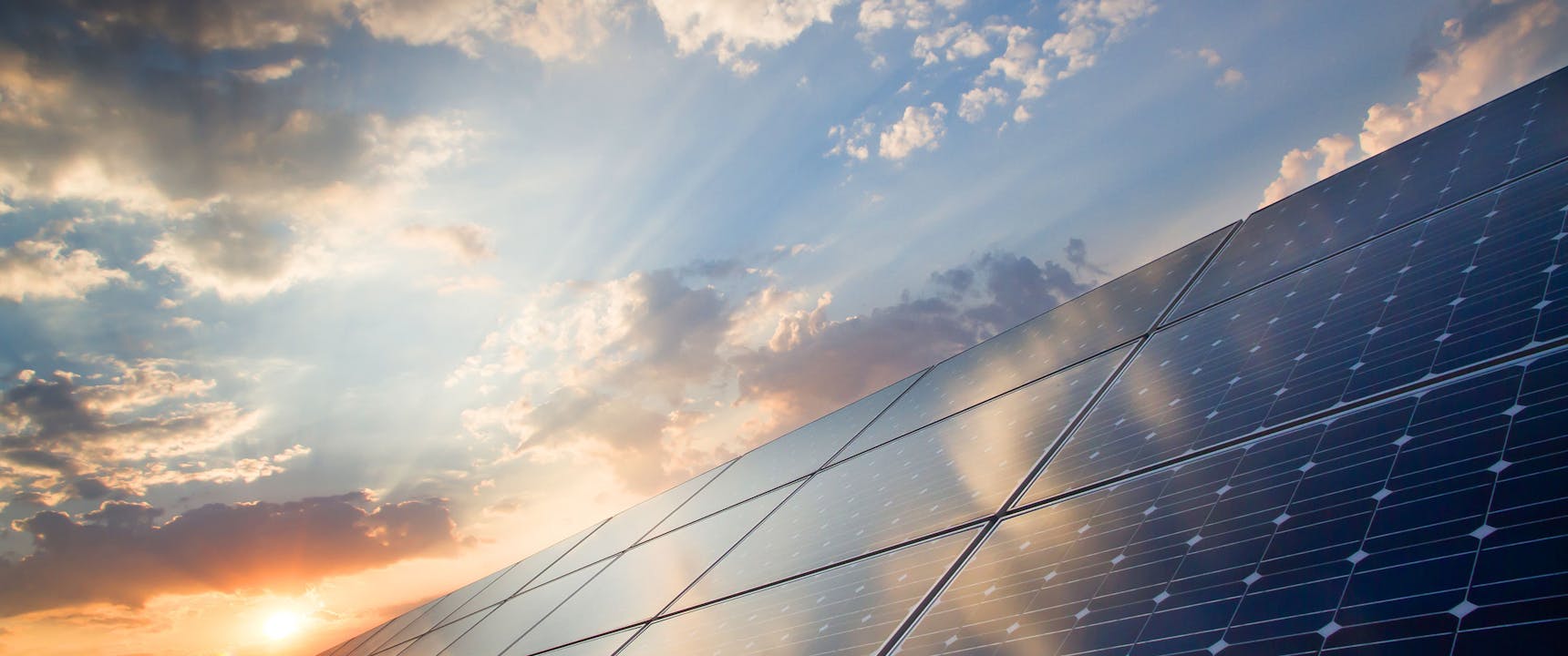 Solar panels with sun setting