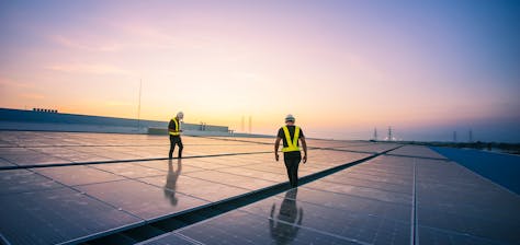 Solar panel professionals installing solar panels