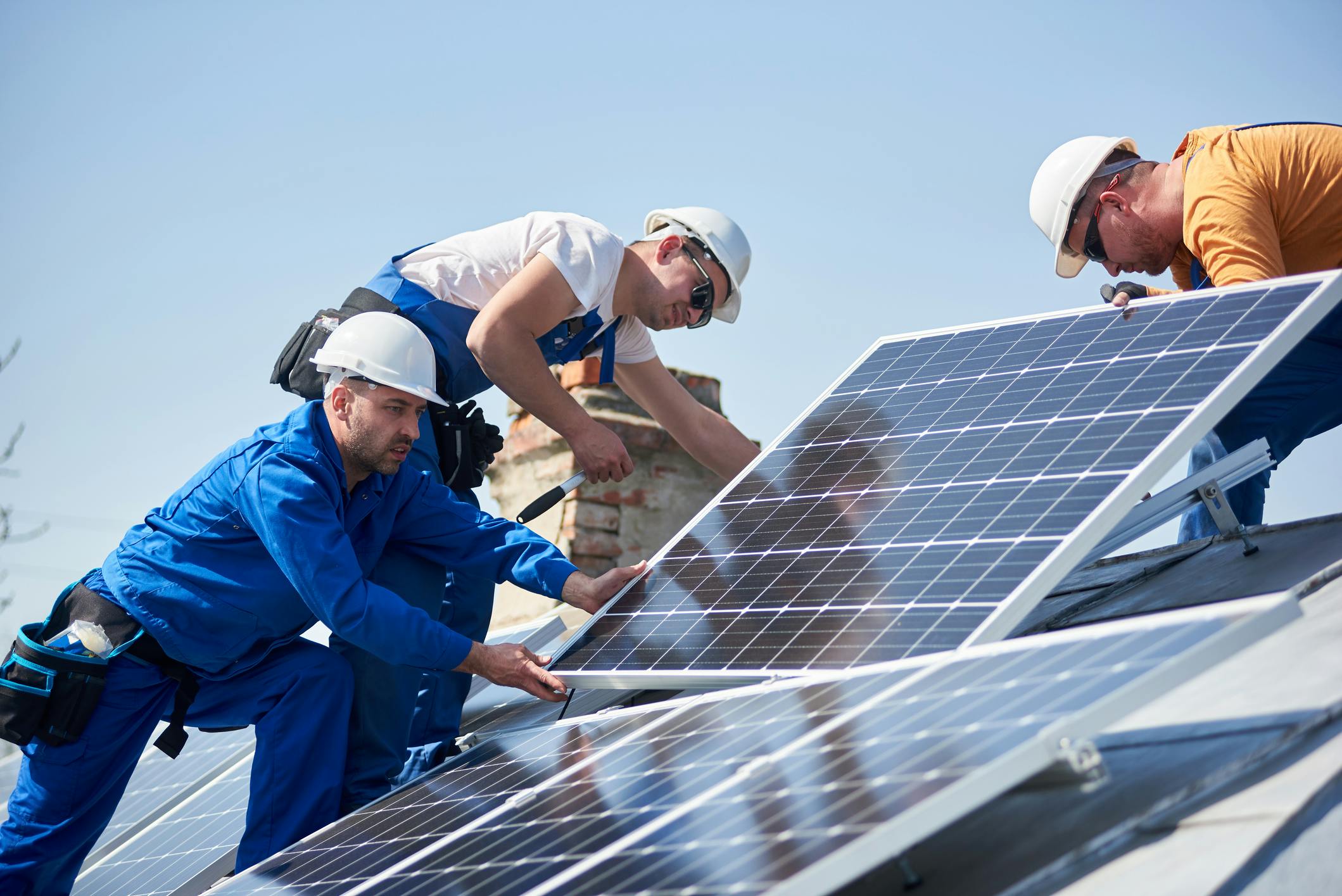 Men installing Solar Panels