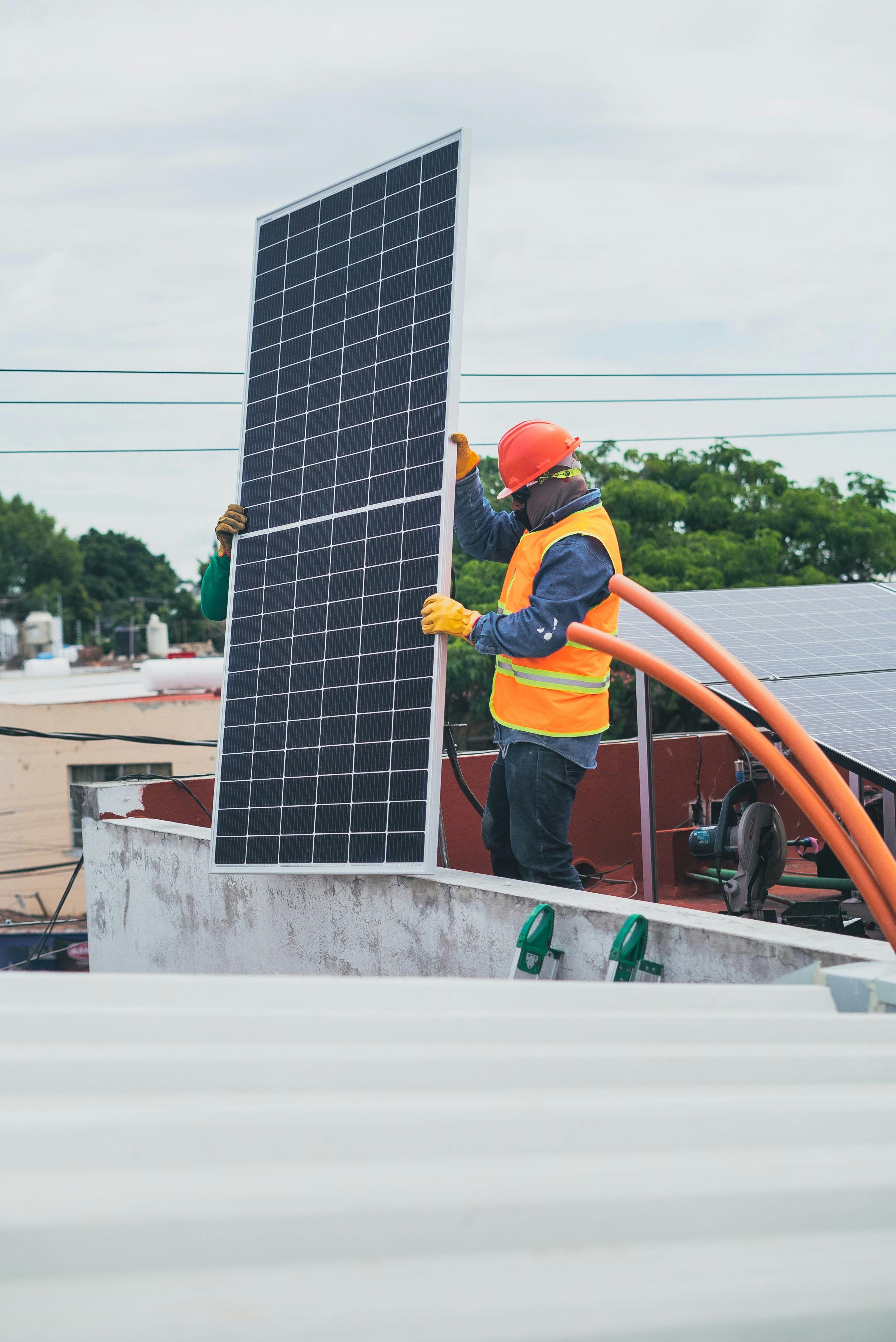 man installing solar panels