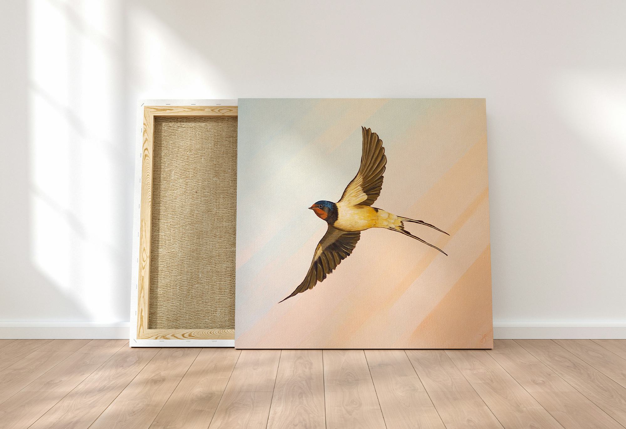 Painting of a welcome swallow on a canvas, leaned against the wall, with its wings spread, on an abstract pastel background.