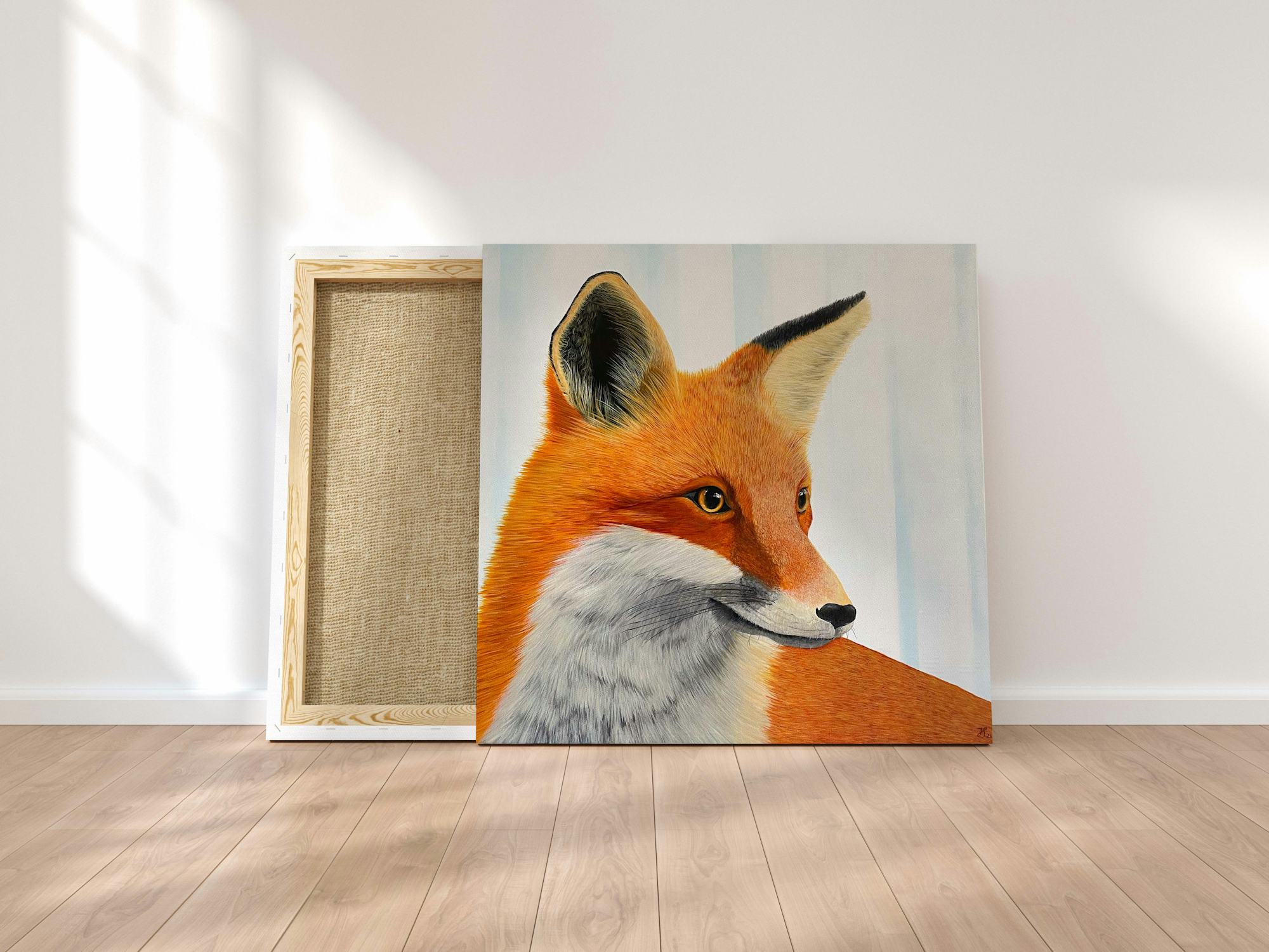 Painting of a red fox on a canvas that's leaned against the wall with sunlight shining in