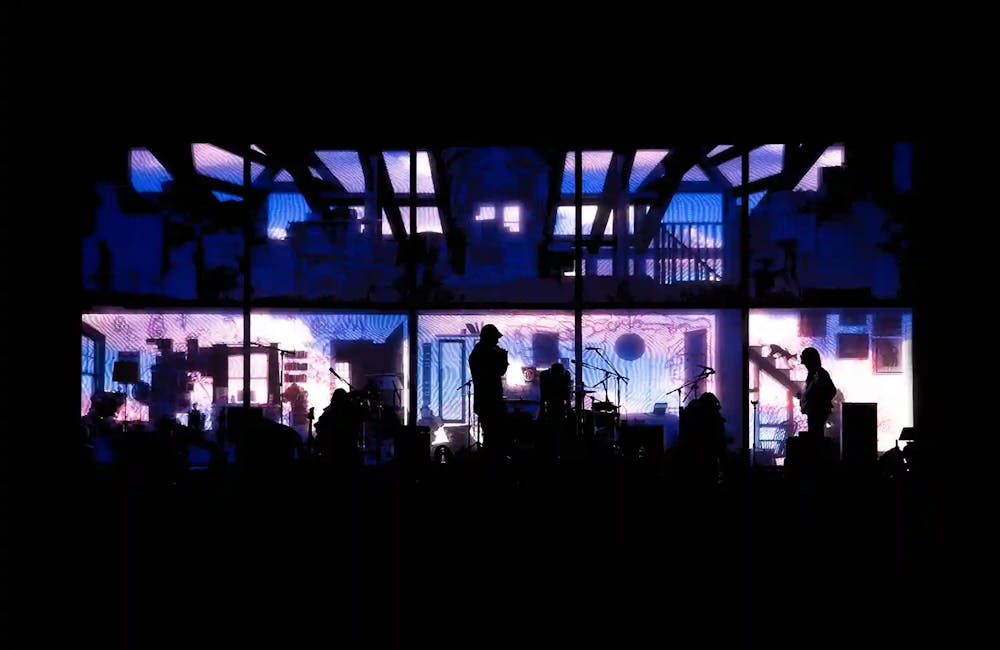stage design LED screen content for mura masa world tour. Impression of teenage room silhouette with colourful video content projected over walls