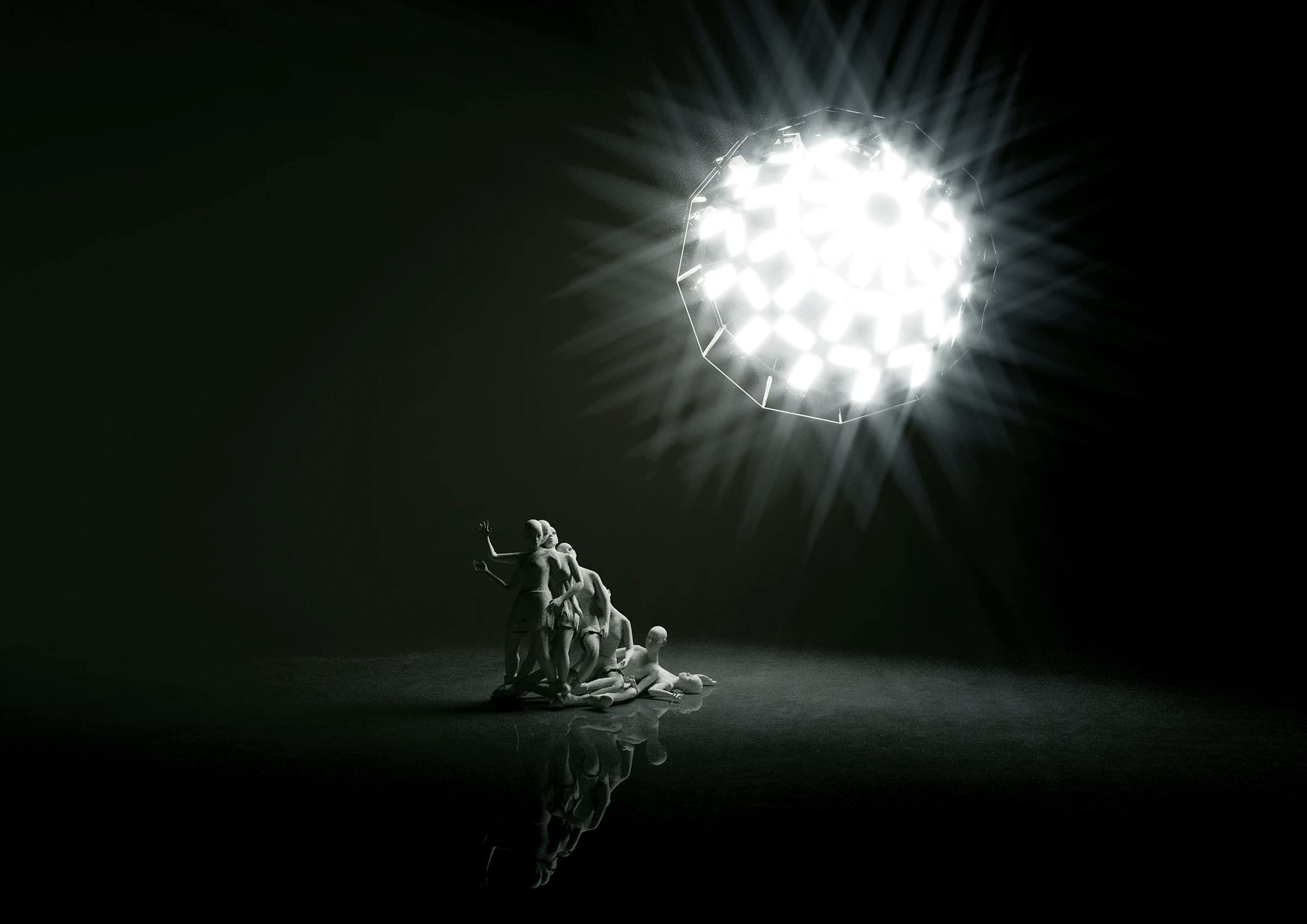 Giant stage light illuminating group of dancers in dance performance