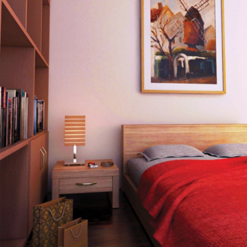 Massivholzbett und Holzschrank unter Bild