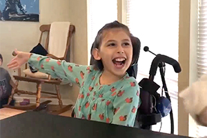 Happy young girl in wheelchair