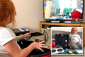 Young girl using adapted gaming setup