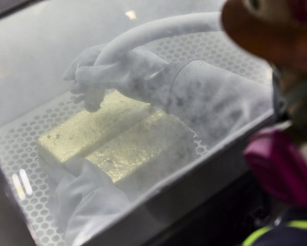 Gold Bars Being Cleaned After Casting / Cortez Gold Mine Refinery / Elko / Nevada / 2024