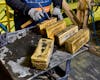 Gold Bars Being Cleaned After Casting / Cortez Gold Mine Refinery / Elko / Nevada / 2024