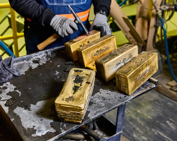 Gold Bars Being Cleaned After Casting / Cortez Gold Mine Refinery / Elko / Nevada / 2024