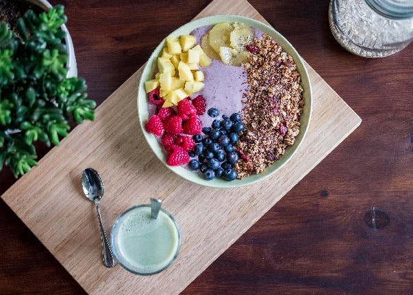 Fruits on a plate, on a wooden board